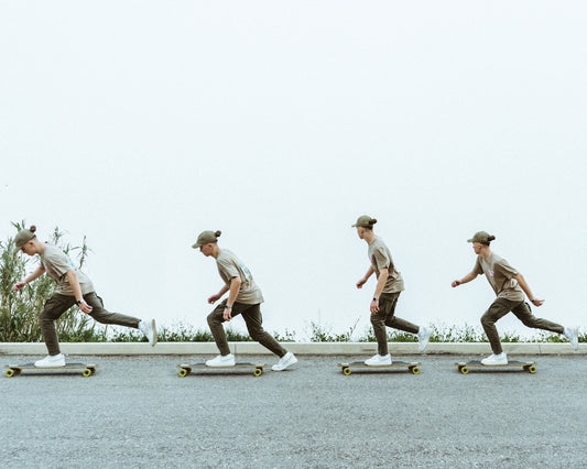 a man riding a skateboard down a street